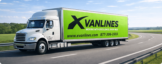A modern white Xvanlines moving truck with a bright green cargo box driving along a scenic highway on a clear, sunny day.