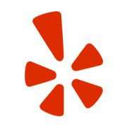 The official red starburst logo for Yelp, featuring five red petals and one larger vertical petal, presented on a plain white background.